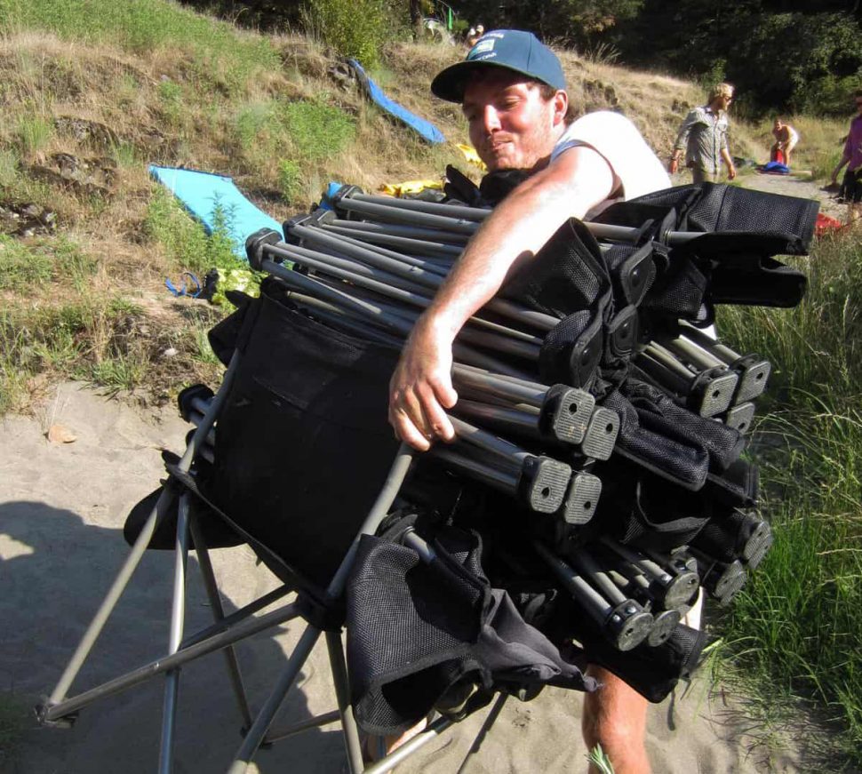 Nate demonstrating his ability to carry 17 chairs